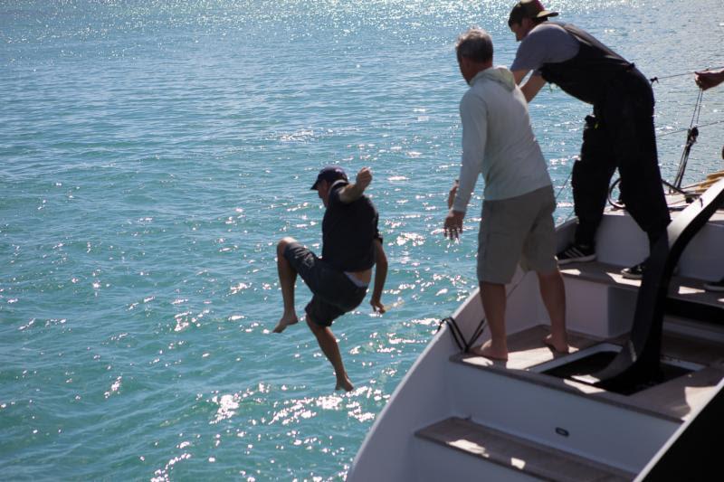 At least the water is warm! John Gallagher gets thrown by his crew after completing the 2019 RORC Caribbean 600 - photo © RORC / Arthur Daniel