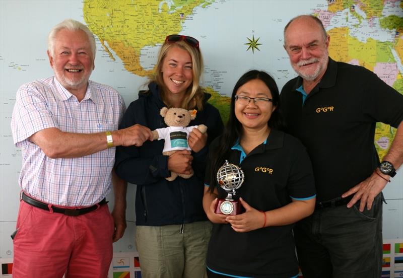 Left to right: Stuart Keane returning the SITraN Teddy to Suzy Goodall accompanied by Race organisers Jane and Don McIntyre - photo © Tina Martin / PPL / GGR