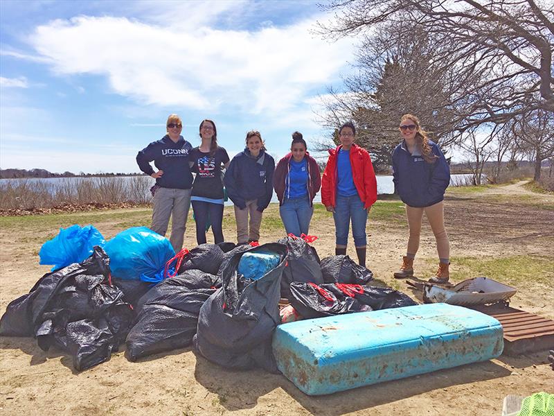 Volunteers remove marine debris from the shoreline. - photo © Mystic Aquarium