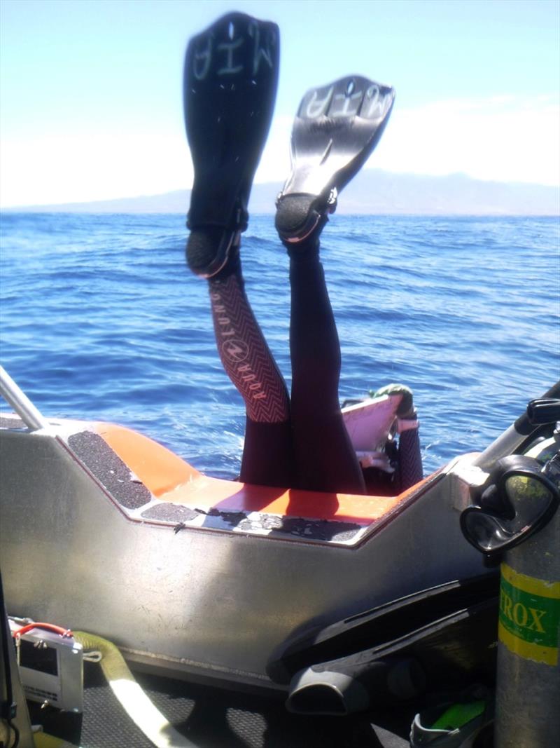 QUEST Intern Mia Lamirand executes a textbook backroll into the waters off Lana'i to begin fish survey. The Pacific Islands Fisheries Science Center offers graduates of UH-Hilo QUEST Program the opportunity to join these expeditions - photo © NOAA Fisheries / Raymond Boland