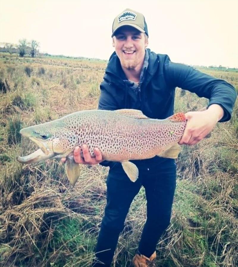 Brady with a large brown from Brumbies Creek - photo © Carl Hyland
