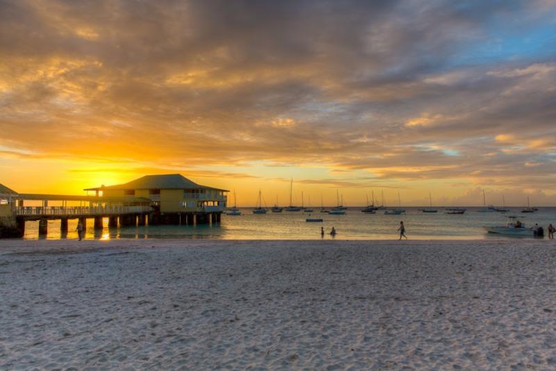 Sunset over Carlisle Bay. The perfect time to relax and enjoy a Mount Gay Rum after racing - Barbados Sailing Week photo copyright Nigel Wallace taken at Barbados Cruising Club