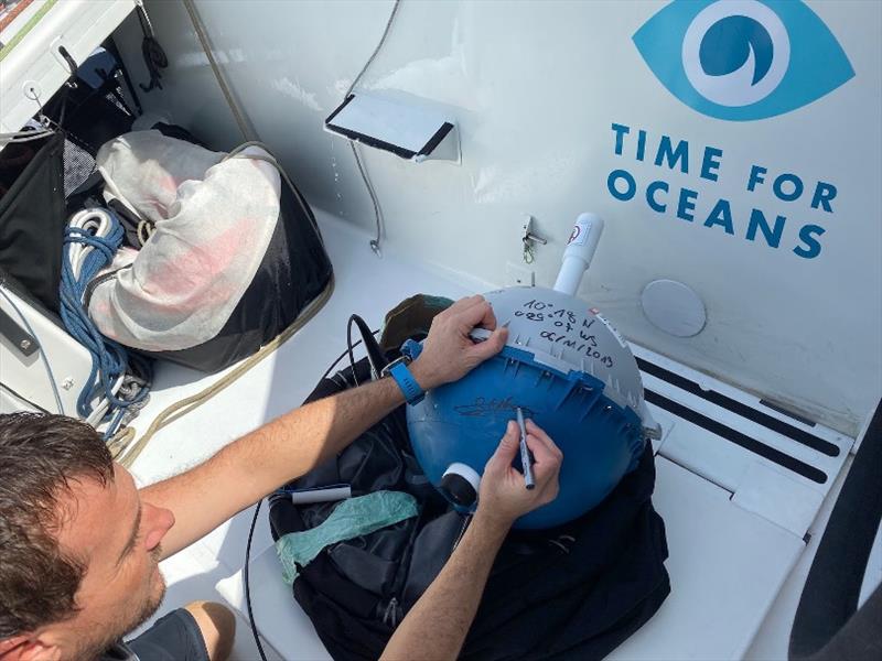 Stéphane Le Diraison preparing to drop his weather buoy in the 2019 Transat Jacques Vabre photo copyright Time For Oceans taken at 