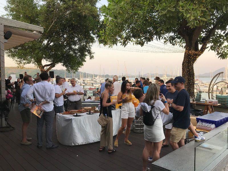 The networking party in full swing at sunset looking over Phuket Yacht Haven Marina. - photo © AIMEX
