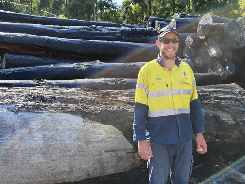 Shane of Hydrowood, wielder of the great excavator claw - photo © Australian Wooden Boat Festival