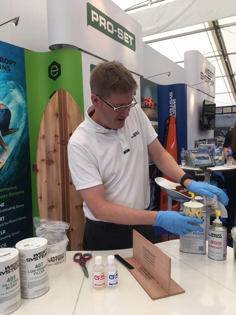 Hamish Cook from Wessex Resins and Adhesives demonstrating West System epoxy techniques photo copyright Wessex Resins and Adhesives taken at 