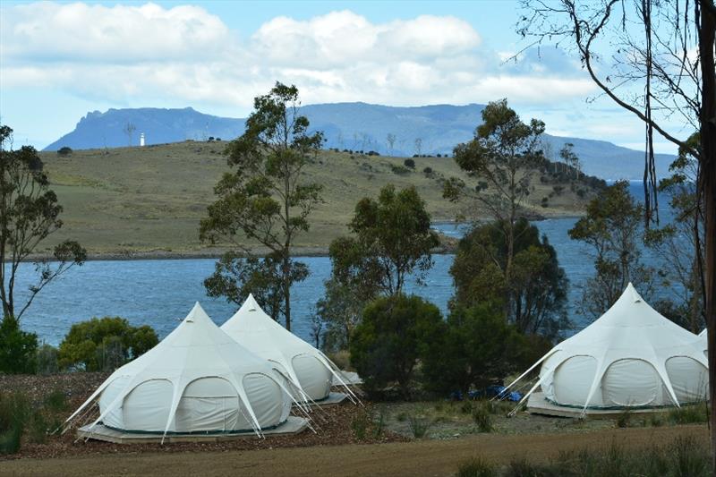 Glamping tents at the Spring Bay Mill with Maria Island National Park in the background - photo © Jane Austin
