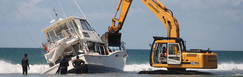 The vessel couldn't be winched free of the water and was eventually broken up and removed by diggers photo copyright Bay of Plenty Times taken at 