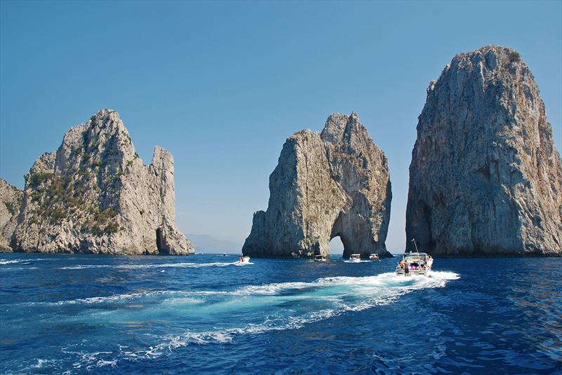 Summertime in Capri; the famous Faraglioni rocks - photo © West Nautical