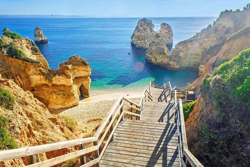 Wooden footbridge to the beautiful beach Praia do Camilo near Lagos in Portugal's Algarve region, which has no less than 31 golf resorts! - photo © West Nautical