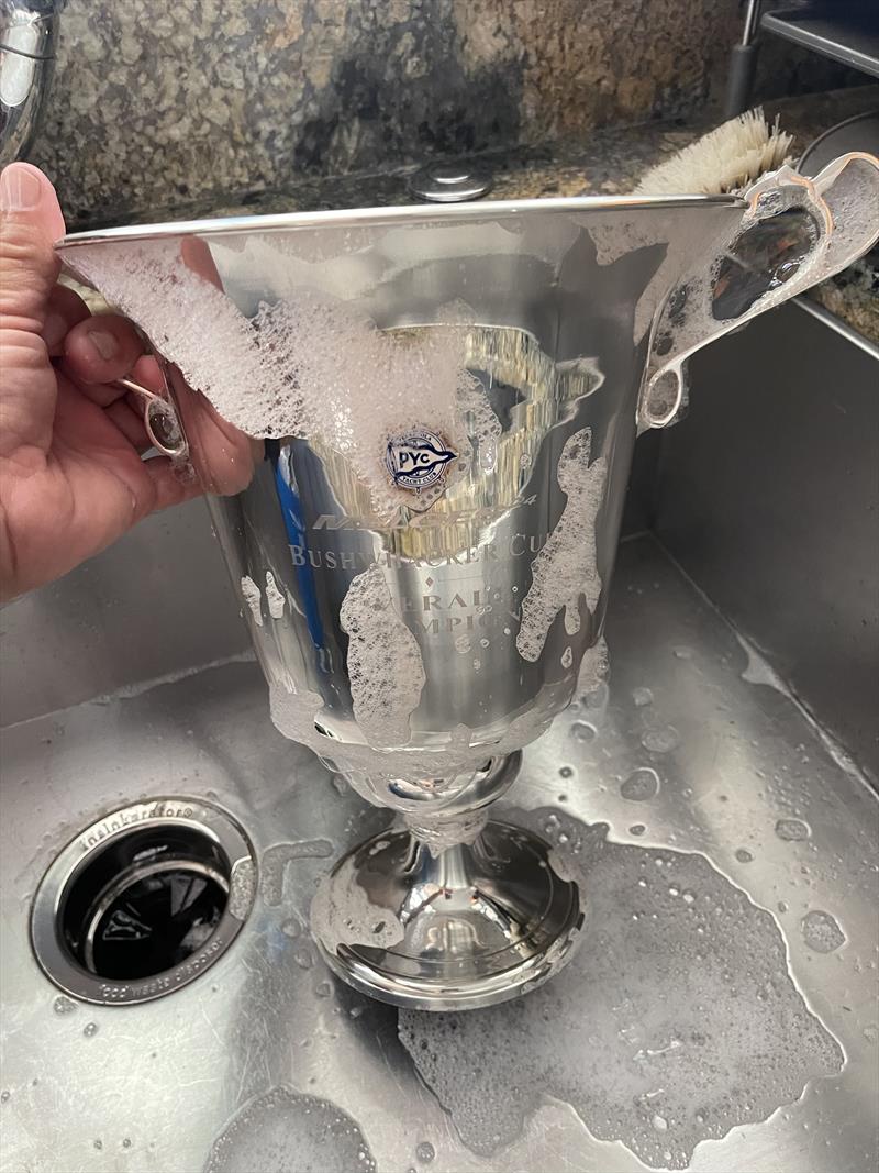 Bushwhacker Cup regatta Chairman Tom Pace polishes the Bushwhacker Cup. The cup is the combined prize for the regatta which includes both the Atlantic and Gulf Coast Championships and is also the final race in the US Melges 24 National Ranking Series photo copyright Tom Pace taken at Pensacola Yacht Club