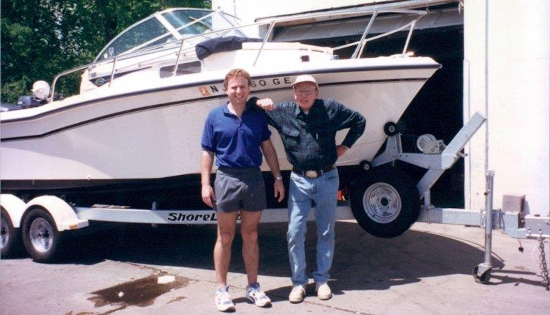Roger and his dad, Roger Muller, Sr. pictured in front of their first Grady-White, an Adventure 208 they bought in 1998 photo copyright Grady-White taken at 