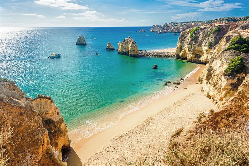 With white sand beaches and rugged, rocky coves, its plain to see why Portugal attracts surfers from all corners of the globe. This one is near Lagos in Ponta da Piedade, Algarve region, Portugal photo copyright West Nautical taken at 