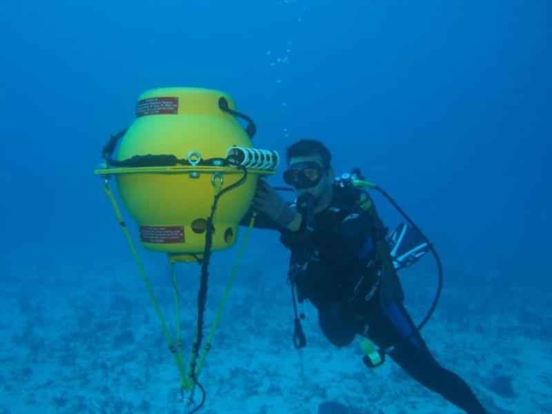 Jeremy Kiszka of Florida International University checks on one of the Marine Autonomous Recording Units (MARUs) deployed in the Caribbean in 2017 to record humpback songs and other ocean sounds photo copyright NOAA Fisheries taken at 