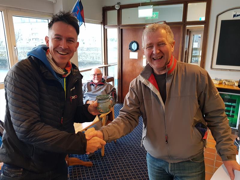 Brendan Foley (L) gets his Frostbite Mug from Neil Colin (R) on Dun Laoghaire Frostbite Series 2 Day 5 - photo © Frank Miller