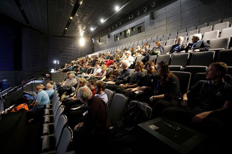 Attendees watching the opening plenary in the cinema photo copyright Max Mudie / UK Sail Training taken at 