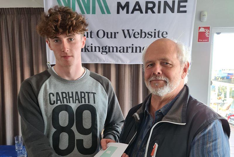 Daniel O'Connor (ILCA 4) [1st Overall (Series 1 & 2)] with sponsor Ian O'Meara - Viking Marine Frostbite Series prize-giving at Dun Laoghaire photo copyright Frank Miller taken at Dun Laoghaire Motor Yacht Club