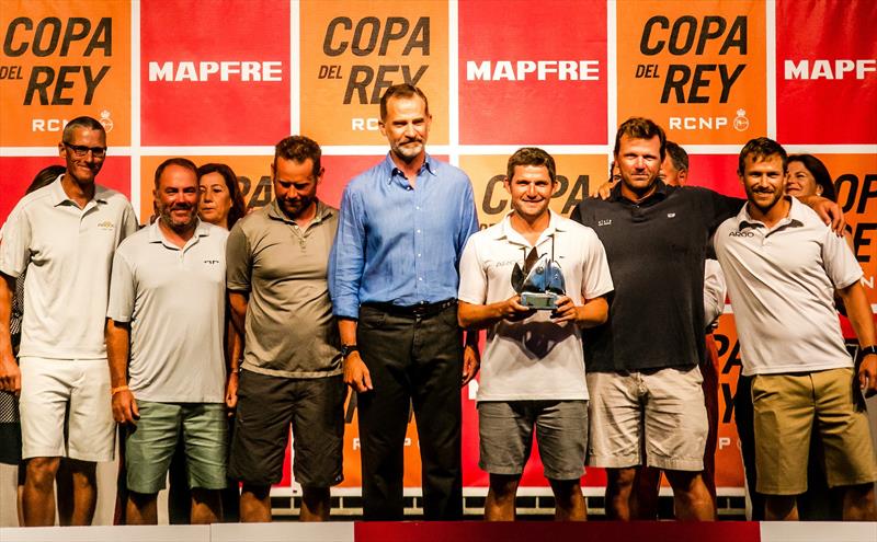 Jason Carroll (third from the right) and his Argo crew collect their Copa del Rey MAPFRE trophy from King Felipe VI of Spain photo copyright Sailing Energy / GC32 Racing Tour taken at 