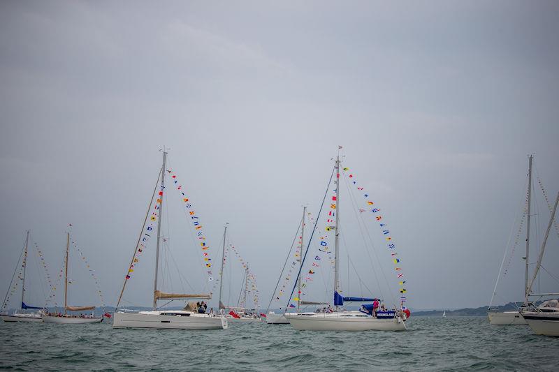 Part of the spectacular line up of members' yachts dressed overall in nautical flags on anchor awaiting the Fleet Review by HRH The Princess Royal photo copyright Sportography taken at Royal Lymington Yacht Club