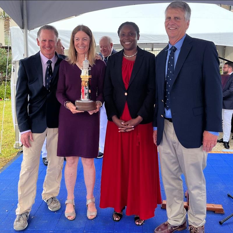 Her Excellency, the Governor of Bermuda, Ms. Rena Lalgie (red dress) presents the St. David's Lighthouse Trophy to the Illusion crew (left to right) Jonathan Livingston, Sally Honey, Stan Honey photo copyright Trixie Wadson taken at Royal Bermuda Yacht Club