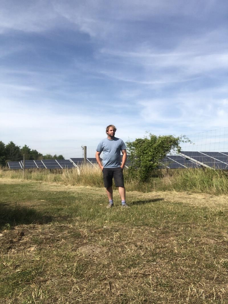 Will Croxford next to his family's solar park photo copyright Global Solo Challenge taken at 
