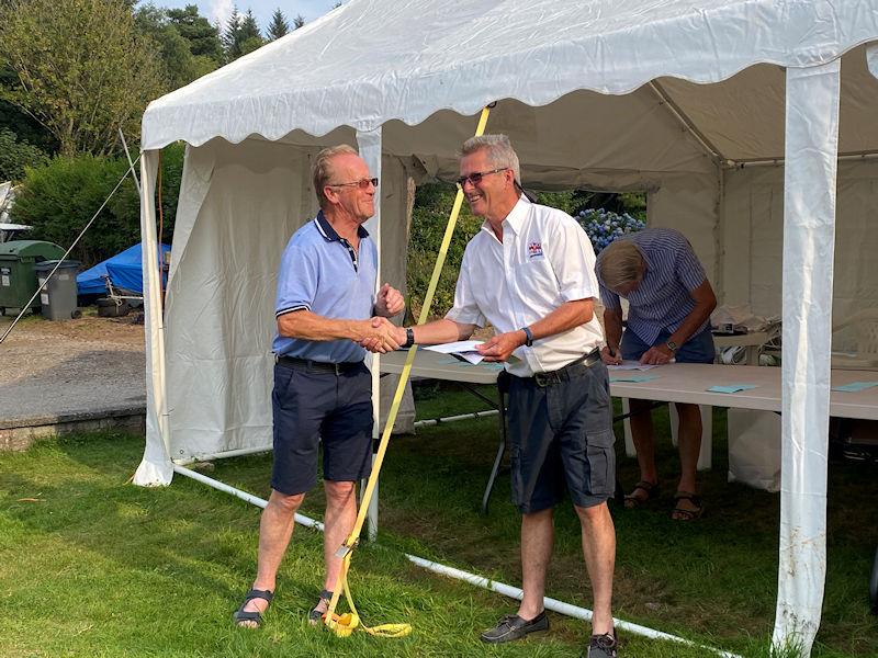 Scott Train (SYC Commodore) presents Gareth Jones (Kippford RNLI Operations Manager) with a substantial cheque with all the entry fees from the Regatta and donations from the recent SYC Challenger open meeting - photo © Beatrice Overend