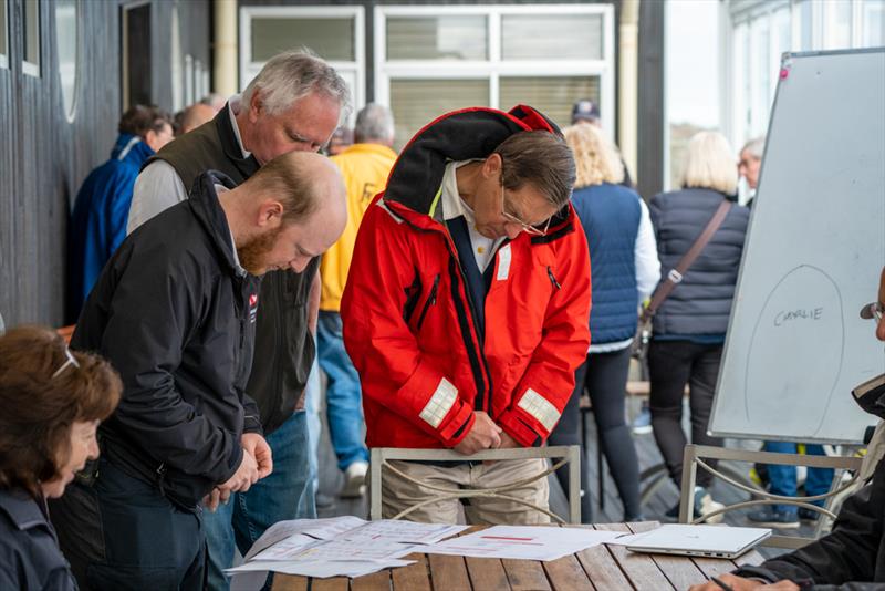 Principal race officer James Sly (left) prepares for the race briefing on Day 1 - Sail Sandy Regatta 2022 photo copyright Jordan Roberts taken at Sandringham Yacht Club