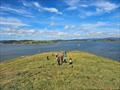 Solway Yacht Club Cadets Adventure Day - The return walk down from the summit of Hestan Island. “Alicat” lying at anchor way below © Finlay Train