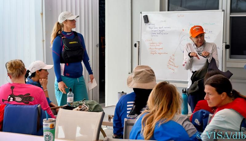 Chalk talk ashore at the St Thomas Yacht Club. Instructor Rebecca Ellis (standing left), and St. Croix's Joyce Campbell at the whiteboard - photo © VISA / Dean Barnes