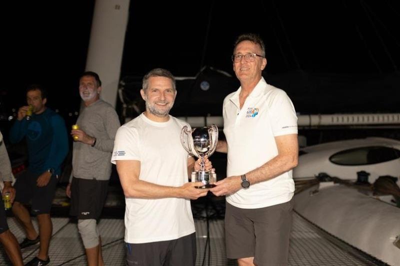 RORC CEO Jeremy Wilton presents Jason Carroll with the Multihull Line Honours trophy - 2024 RORC Caribbean 600 day 3 - photo © Arthur Daniel / RORC