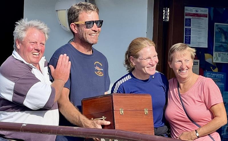 Cardigan Bay Regatta at New Quay: Overall winners, Brainstorm – Chris Seal (l) Roma Kearns and Debbie Johnson (Justin Davies gone to the bar!) - Melrose Trophy presented by Huw Williams (RNLI) photo copyright Rees Tom Jones, Martyn Johnson, Fiona Lloyd Evans, Chris Seal taken at New Quay Yacht Club
