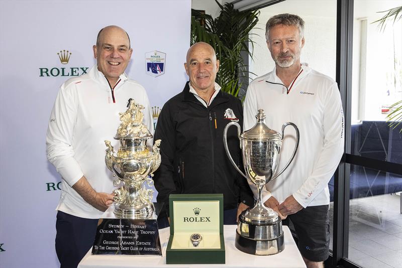 Master Lock Comanche co-skippers Matt Allen and James Mayo and LawConnect owner and skipper Christian Beck standing in front of the trophy for the overall winner, Rolex timepiece and Line Honours trophy  photo copyright CYCA | Andrea Francolini taken at Cruising Yacht Club of Australia