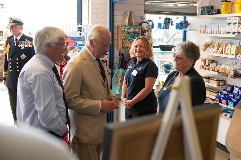 His Majesty being introduced to two shop volunteers by Lifeboat Operations Manager Denis Brophy - photo © Dover Media Group / RNLI