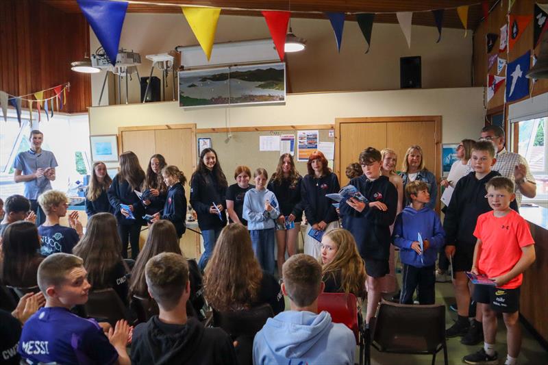 Solway Yacht Club Cadet Week - Senior Instructor, James Bishop (far left) with other instructors and successful  Cadets with the completed RYA certificates and log-books photo copyright Nicola McColm taken at Solway Yacht Club