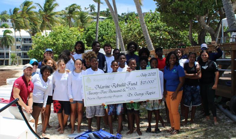 Junior Sailing Summer Program graduates, St. Thomas Sailing Center staff, and representatives from VIPCA and RapierMed on the beach in front of the St. Thomas Yacht Club photo copyright STSC / C. Bareuther taken at St. Thomas Sailing Center