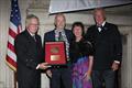 © Guy Gurney Blue Water Medal awardee Pete Hill and partner Linda Crew-Gee receive the honor from the incoming CCA Commodore Chace Anderson, left, and outgoing CCA Commodore Jay Gowell © Guy Gurney