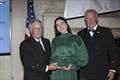 © Guy Gurney Young Voyager Award recipient Tamara Klink receives the honor from the incoming CCA Commodore Chace Anderson, left, and outgoing CCA Commodore Jay Gowell © Guy Gurney