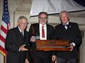 © Guy Gurney Philip “Greg” Velez, center, receives the Rod Stephens Seamanship Trophy from the incoming CCA Commodore Chace Anderson, left, and outgoing CCA Commodore Jay Gowell © Guy Gurney