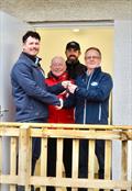 Handover day of the new facility, Paul Widdowson (left), and Martin Stitt (rear) Directors of South West Trades hand the keys to Scott Train, Commodore of the Solway Yacht Club with Robert Dinwiddie, past Commodore (centre) &copy; Kerry Widdowson