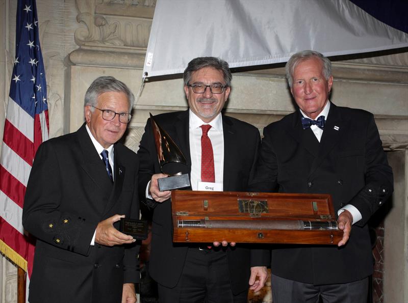 Philip “Greg” Velez, center, receives the Rod Stephens Seamanship Trophy from the incoming CCA Commodore Chace Anderson, left, and outgoing CCA Commodore Jay Gowell photo copyright Guy Gurney taken at Cruising Club of America