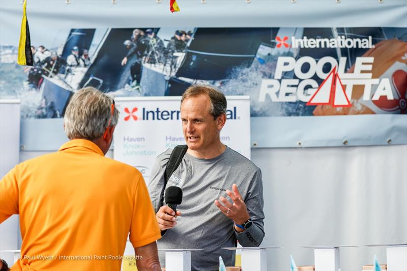 Mark Jardine chatting with Toby Gorman at the International Paint Poole Regatta 2026 Prize Giving - photo © Paul Wyeth / www.pwpictures.com