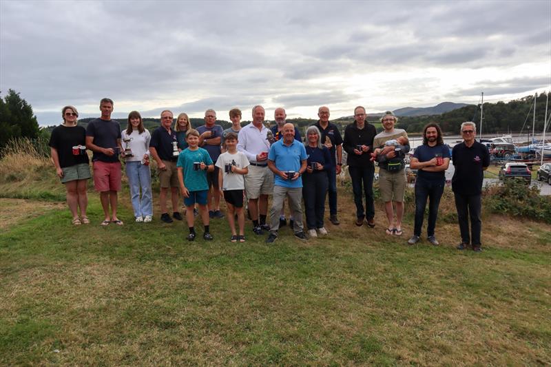 All the winners with their trophies, awards and a baby! Gareth Jones, Kippford RNLI Operations Manager, far right - Solway Yacht Club's Kippford Week and the Kippford RNLI Regatta - photo © Nicola McColm
