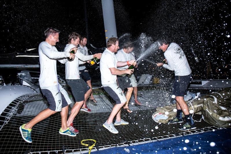 Champagne celebrations on Phaedo3 after the RORC Transatlantic Race photo copyright RORC / Arthur Danie taken at  and featuring the MOD70 class