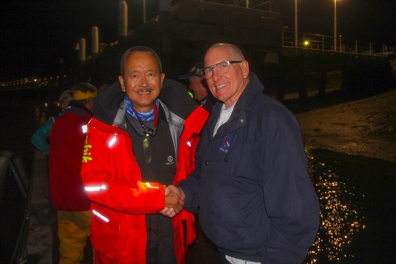 Owner Kark Kwok being congratulated by MYCQ Commodore Bruce Wieland - 55th Brisbane to Gladstone Multihull Yacht Race 2019 photo copyright Chris Dewar taken at  and featuring the MOD70 class