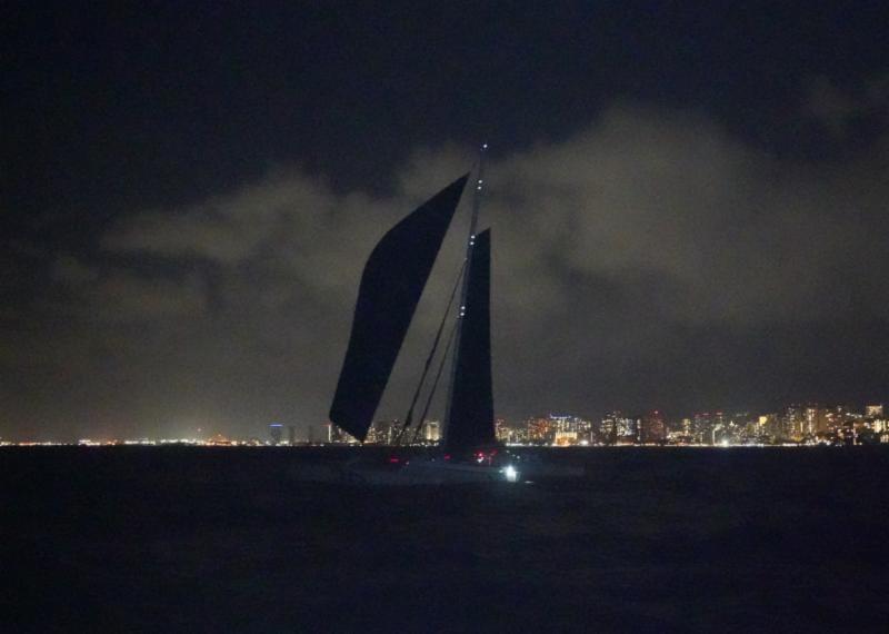 With the glow of Waikiki in the backdrop, Jason Carroll's MOD 70 Argo is first-to-finish in Transpac 50 photo copyright Janet Scheffer / ManaMeans taken at Transpacific Yacht Club and featuring the MOD70 class