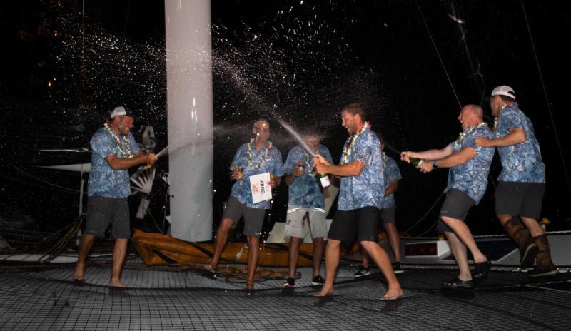Argo team celebrates their line honors victory - Transpac 50 photo copyright Sharon Green / Ultimate Sailing taken at Transpacific Yacht Club and featuring the MOD70 class