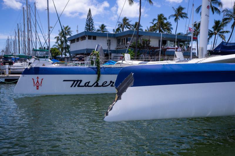 The MOD 70 Maserati showing impact damage suffered to the port hull during the first night of the race. The high-tech carbon fiber boat will be hauled and repaired here in Hawaii photo copyright Walter Cooper / Ultimate Sailin taken at Transpacific Yacht Club and featuring the MOD70 class