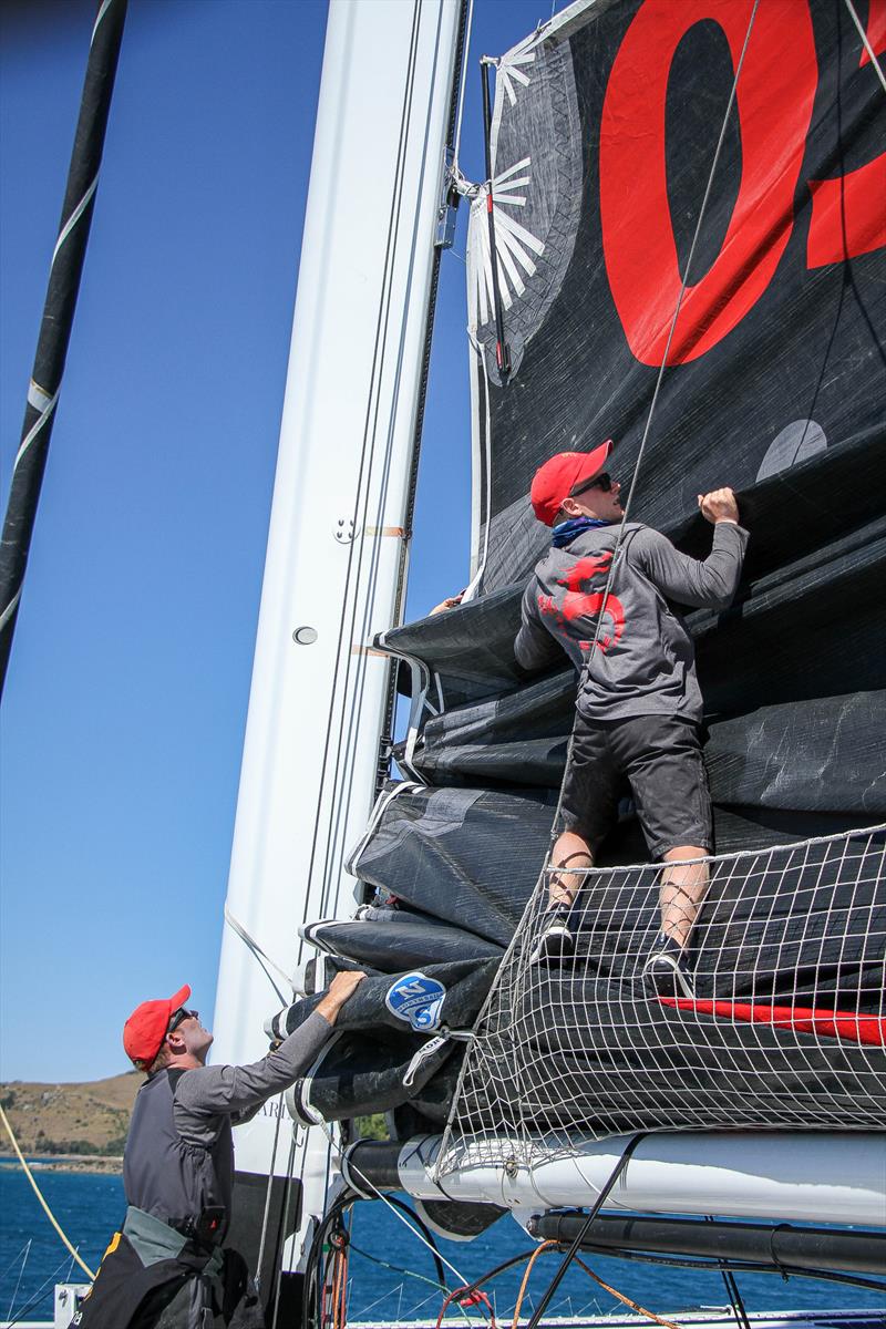 Raising the mainsail - Beau Geste - Day 5 - Hamilton Island Race Week, August 23, 2019 photo copyright Richard Gladwell taken at Hamilton Island Yacht Club and featuring the MOD70 class