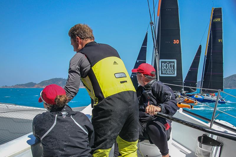 Carrington Brady (left) Matt Humphries, and Gavin Brady are all concentration at the Multihull start at Hamilton Island Race Week photo copyright Richard Gladwell / Sail-World.com taken at Hamilton Island Yacht Club and featuring the MOD70 class