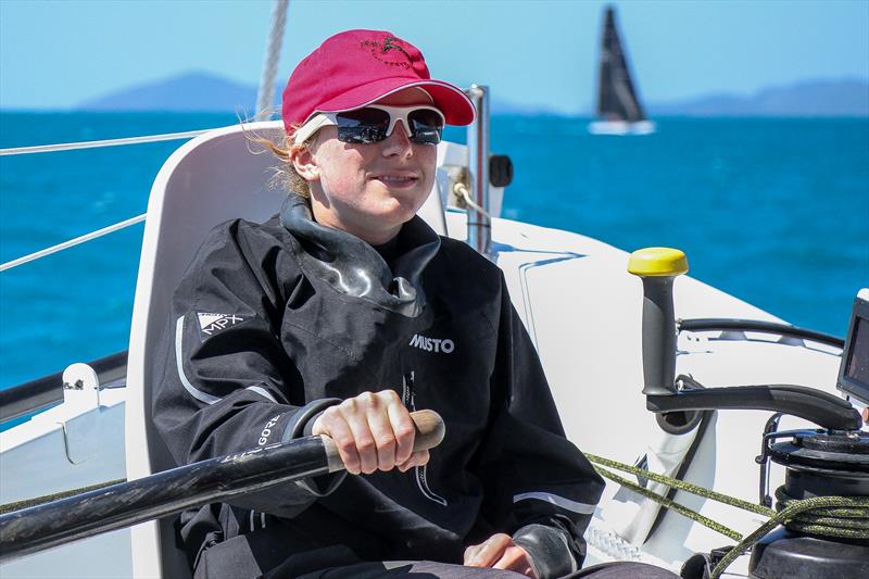 Carrington Brady on the helm between races at Hamilton Island Race Week photo copyright Richard Gladwell / Sail-World.com taken at Hamilton Island Yacht Club and featuring the MOD70 class